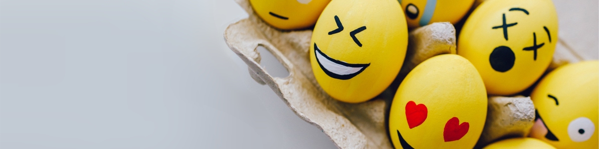 Collection of laughing emoticons painted on eggs