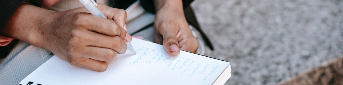 HR manager writing list of complaints from staff when they're booking leave with many employers